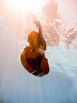 Violin underwater in the pool
