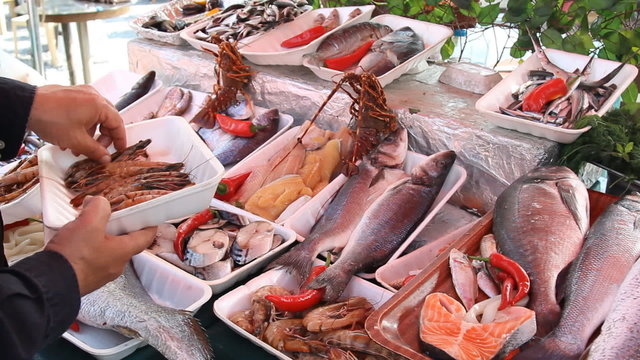 fishmonger sells the fresh fish at the fish market in Turkey