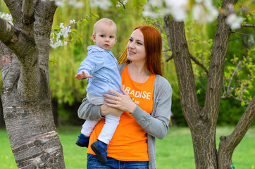 a mother plays the nature with babies