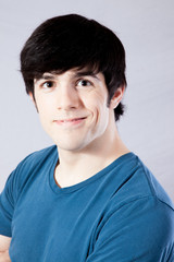 Fototapeta premium Man in blue shirt, smiling with joy