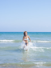 Fototapeta premium Woman on the beach in Kuta Bali