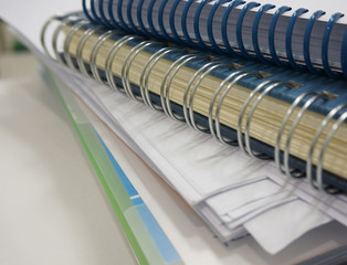 Stack of papers and notebook