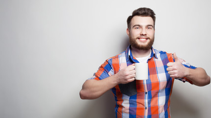 man with a cup of coffee