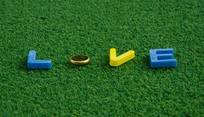 love letter message on green grass background