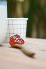 Spoon of strawberry jam