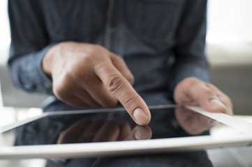 Men have an electronic tablet