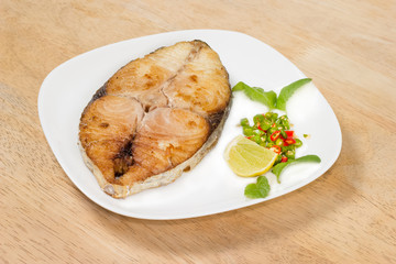 spanish mackerel steak on wood background,fried fish