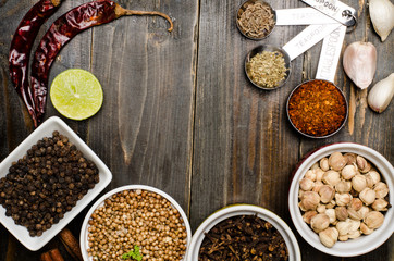 Herbs and spices on wooden background