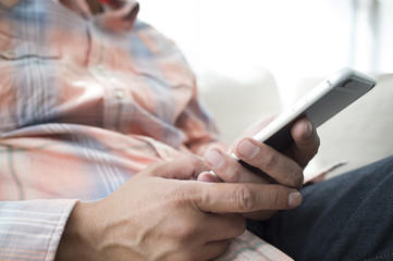 Men relaxing on a couch at home