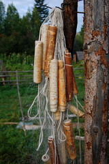 Fishing net with floats made of birch bark.