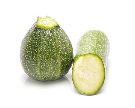 fresh green zucchini isolated on white background