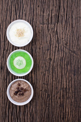homemade body scrubs on wood background