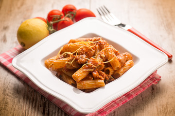 spaghetti with swordfish ragout and lemon peel, selective focus