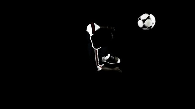 Bird's eye view of a soccer player juggling the ball and doing tricks