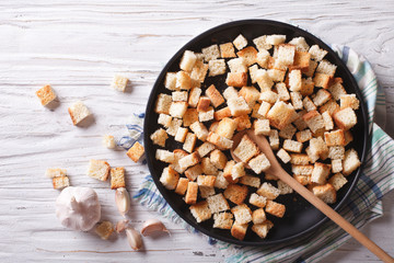 Homemade croutons in a bowl horizontal view top
 - obrazy, fototapety, plakaty