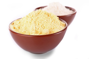 Flour in bowls isolated on white