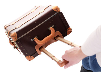 Woman with suitcase isolated on white
