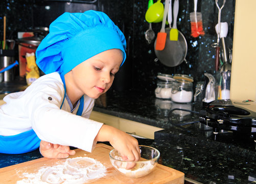little boy enjoy cooking in kitchen
