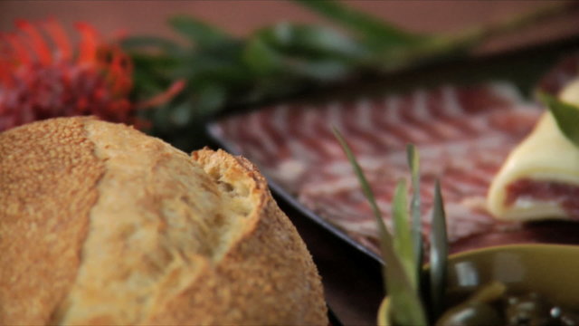 A tapas spread full of various snacks laid out on a restaurant table