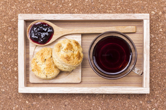 Scone,jam,coffee On Wooden Tray.