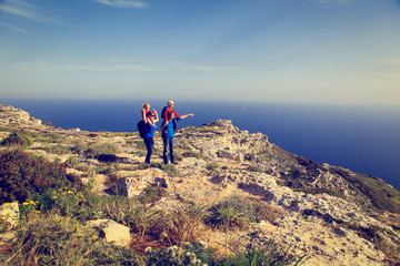 Fototapeta premium family with kids hiking in summer mountains