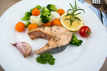 Grilled salmon steak and vegetables