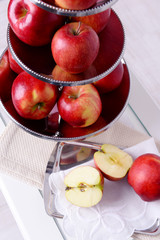 Tasty ripe apples on serving tray on table close up