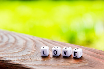 The inscription of the cubes love on a wooden table