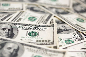 A pile of one hundred dollar bills