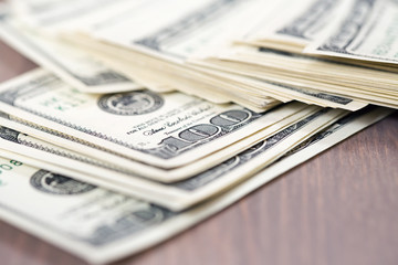 A pile of one hundred dollar bills