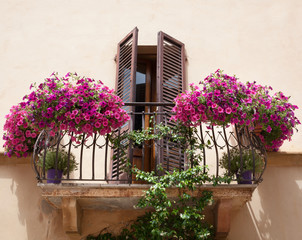 Flowers on a balcony in Pienza Tuscany