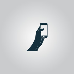 Mobile phone in hand icon