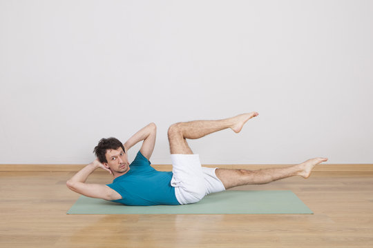 man practicing pilates indoor, return to life sequence, 34 exerc