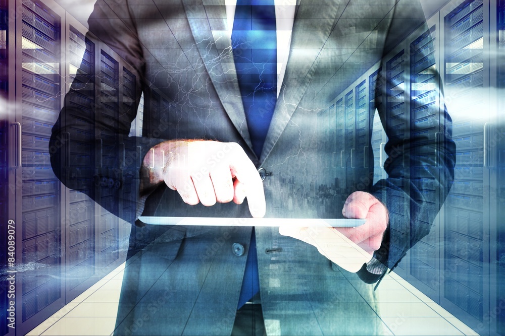 Poster composite image of businessman using his tablet pc