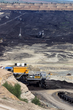 open pit coal mine with machinery and excavators