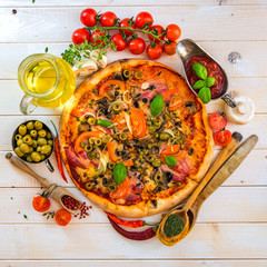 Pizza with ham and olives