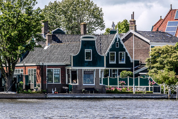 Dutch rural scenery: small village on river shore in Zaandam.