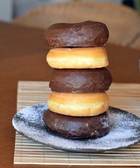 Stack Of Homemeade Donuts On The Wooden Table