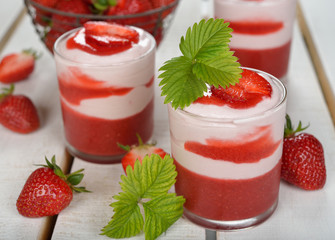 Dessert with strawberry jelly and whipped cream