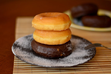 Stack Of Homemade Donuts On The Wooden Table