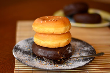 Stack Of Homemade Donuts On The Wooden Table