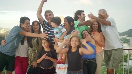 Family posing for a portrait at a Brazilian family BBQ - Powered by Adobe
