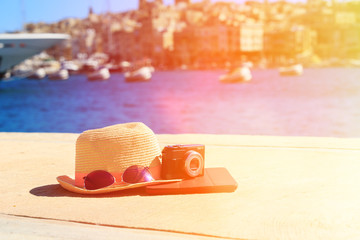 hat, glasses, camera and touch pad in summer Malta
