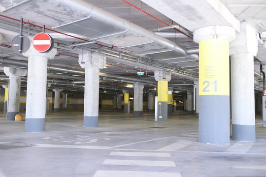Underground park of a mall with columns and ventilation ducts