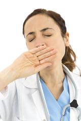 Exhausted nurse or doctor yawning