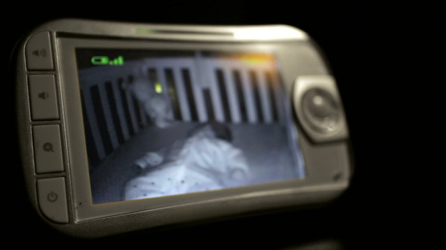 Baby sleeping on a video monitor.