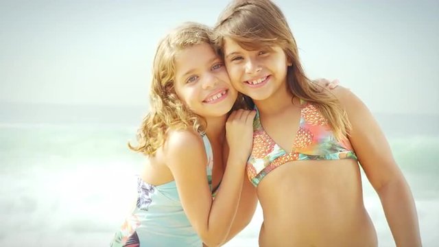 Young Brazilian girls smile on a beach in Brazil