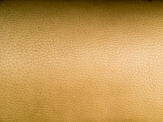 Tan leather texture. Close-up photo