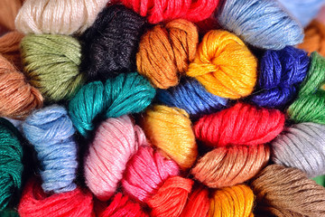 Colorful skeins of floss as background texture