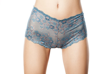 blue lace panties on skinny young woman - obrazy, fototapety, plakaty